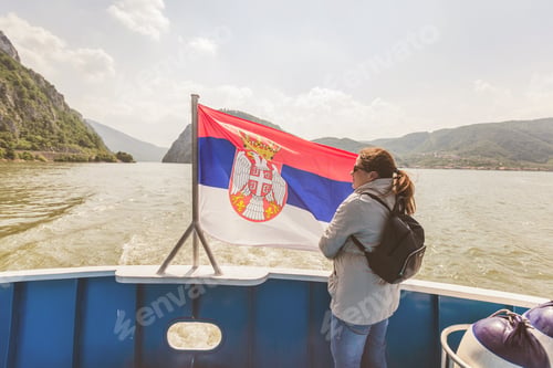 Preview: Woman On River Cruise With Serbian National Flag Enjoy View Of Danube Gorge