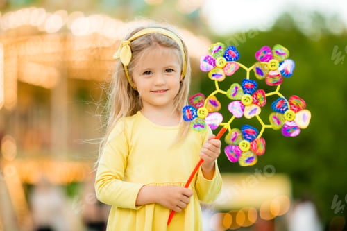 Preview: Little Blonde Girl In Amusement Park, Baby Girl In Yellow Dress For A Walk In Summer,International