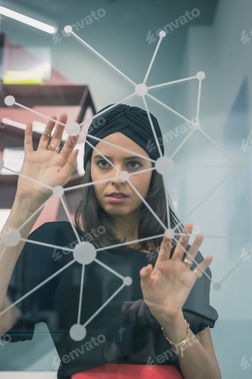 Preview: Beautiful Young Brunette With Turban Working On A Virtual Screen