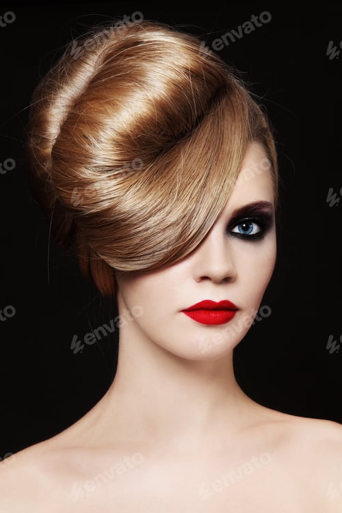 Preview: Young Beautiful Woman With Fancy Hairdo And Smoky Eyes