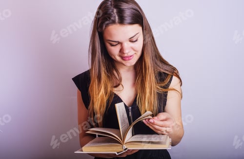 Preview: Young Caucasian Female With Books On Grey Background, Education Concept