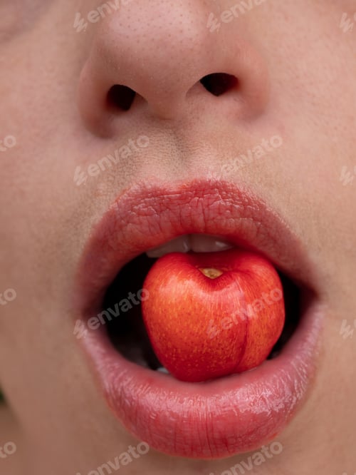 Preview: Girl Holds Cherries In Her Mouth. Close-Up Lips With Berries