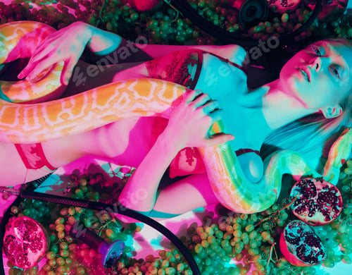 Preview: A Young Blonde Girl In Lingerie Lies With A Snake Surrounded By Grapes And Pomegranates.