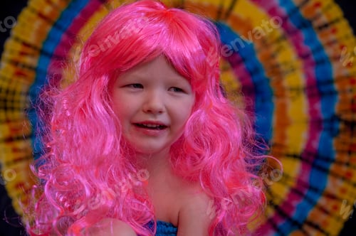 Preview: Happy Cute Caucasian Boy Changed Clothes At Carnival In Dress Of Girl Of Rainbow Color. Pink Doll