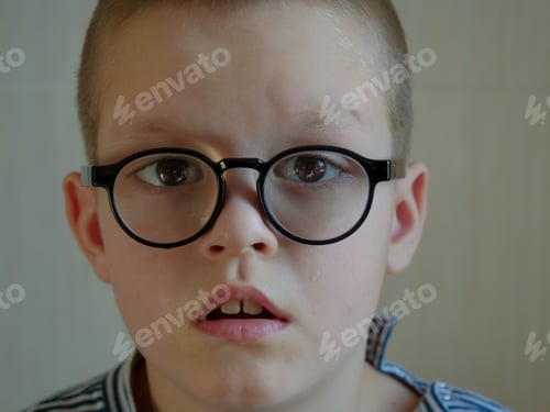 Preview: Beautiful Expressive Anxious Eyes Of Young Boy. Glasses With Thick Glasses. Child Goes To School