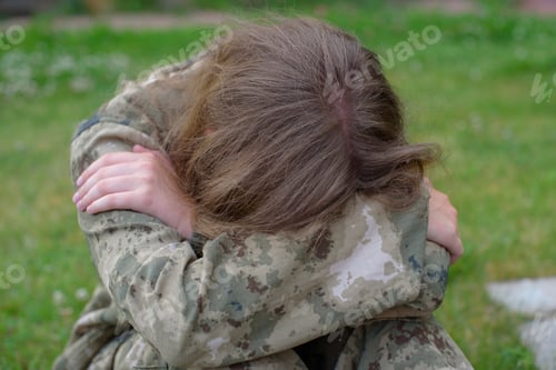 Preview: Teen Girl In Camouflage Saddened