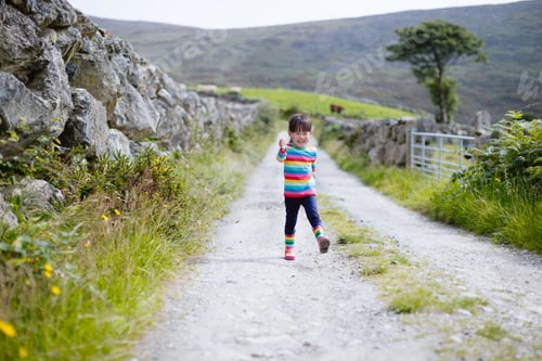Preview: Young Girl Walking On Summer Countryside Road