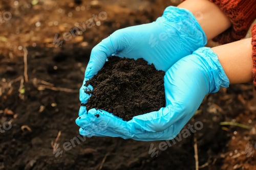 Preview: Woman Holding Black Soil Outdoors