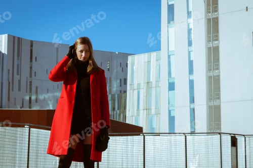 Preview: Beautiful Girl Posing In The Street With Red Coat