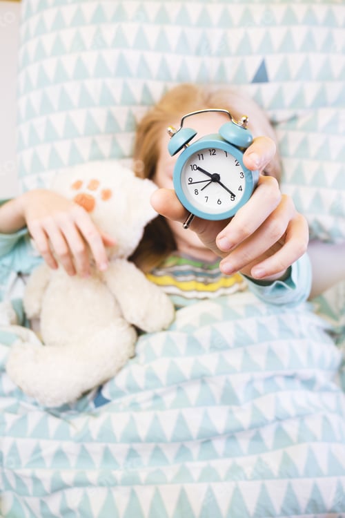Preview: Alarm Clock Disturbing A Sleeping Little Girl That Is Defocused