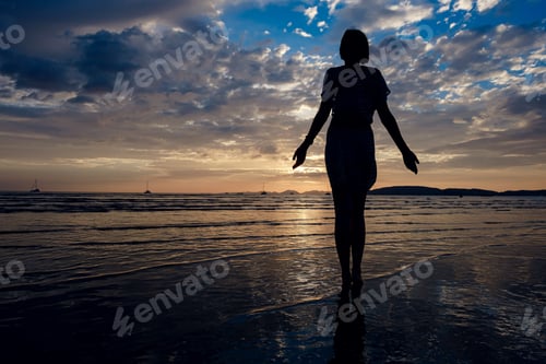 Preview: Happy Carefree Woman Enjoying Beautiful Sunset On The Beach. Famous Ao Nang Beach In Krabi