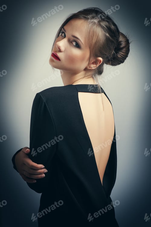 Preview: Portrait Of Beautiful Brunette Woman In Black Dress. Cosmetic Eyeshadows. Fashion Photo
