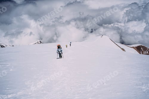 Preview: Group Of People Climbing In High Mountains