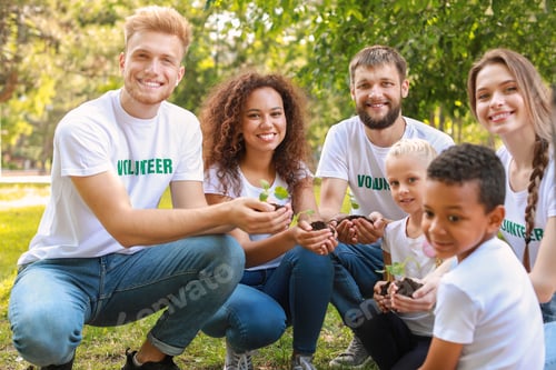 Preview: Volunteers With Young Plants Outdoors