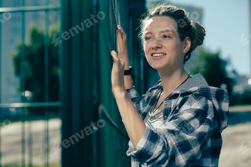 Preview: Smiling Woman in Urban Setting Wearing Plaid Shirt