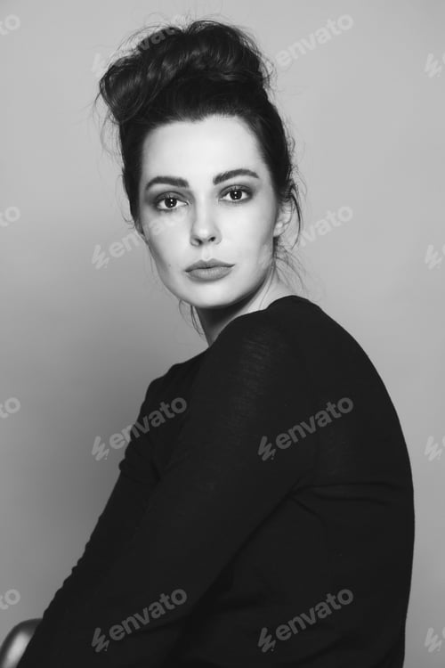 Preview: Black And White Vintage Style Portrait Of Young Beautiful Woman With Fancy Hair Bun