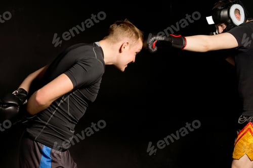 Preview: Two Boxers Spoofing In The Ring During Training As The One Obliging Leans Forwards Presenting His