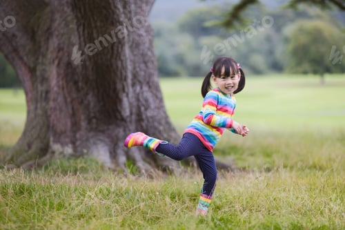 Preview: Young Girl Playing In The Summer Forest Park
