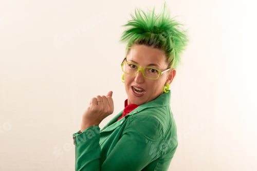 Preview: A Caucasian Girl In A Green Dress And Green Hair Is Preparing For The Holidays. Dress Rehearsal