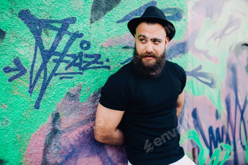 Preview: Bearded Man Is A Macho, Posing Near Wall With Graffiti