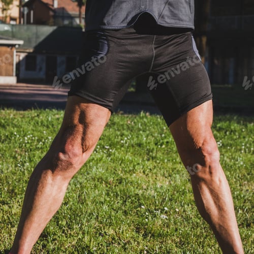 Preview: Detail Of A Muscular Athlete Stretching In A City Park