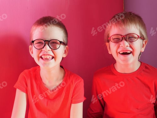 Preview: Funny Children In Red Clothes Posing In Front Of Camera. Boys Actively Express Their Emotions