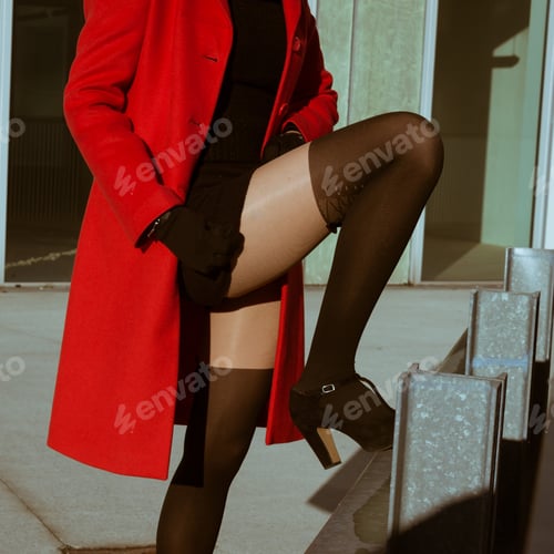 Preview: Beautiful Girl Posing In The Street With Red Coat