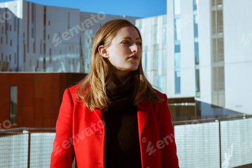 Preview: Beautiful Girl Posing In The Street With Red Coat
