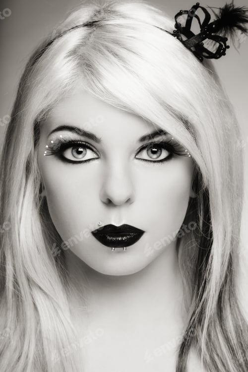 Preview: Duotone Portrait Of Beautiful Young Blond Girl With Fancy Black Make-Up And Piercing