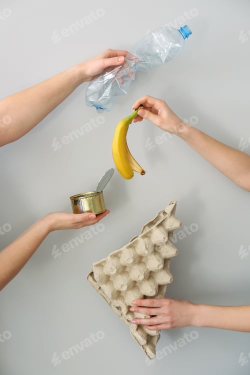 Preview: Hands With Different Types Of Garbage On White Background