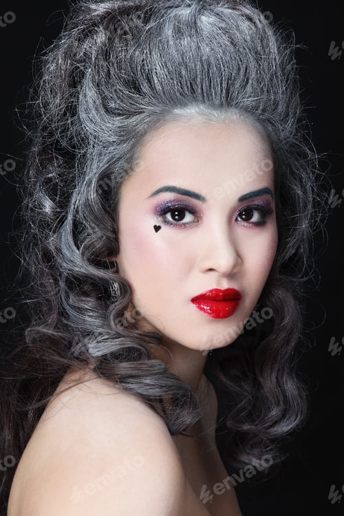 Preview: Portrait Of Young Beautiful Asian Girl With Vintage Hairdo And Stylish Make-Up