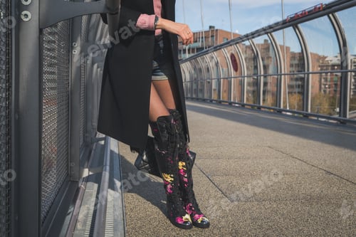 Preview: Detail Of A Beautiful Young Brunette With Over The Knee Boots Posing On A Bridge