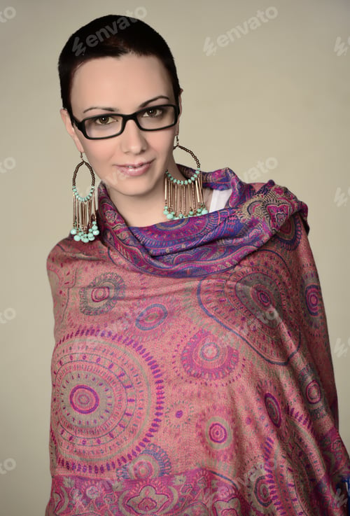 Preview: Beautiful Woman With Short Hair Wearing Eye Glasses And Beautiful Scarf Posing On Camera. Isolated