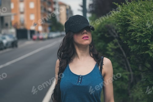 Preview: Beautiful Girl With Long Hair Posing In The City Streets