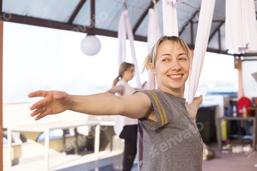 Preview: Healthy And Fly Yoga Concept. Happy Smiling Girl In A Fly Yoga Class
