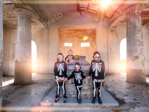 Preview: Children And Their Mother In Carnival Costumes Celebrate Halloween In Cult Place Mortuary Or