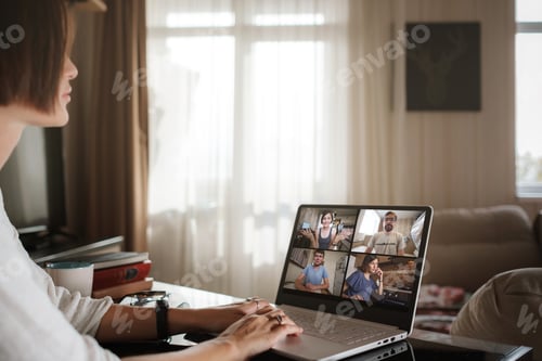 Preview: Smiling Young Asian Woman Video Calling On Laptop. Back View Photo Student Looking At Computer