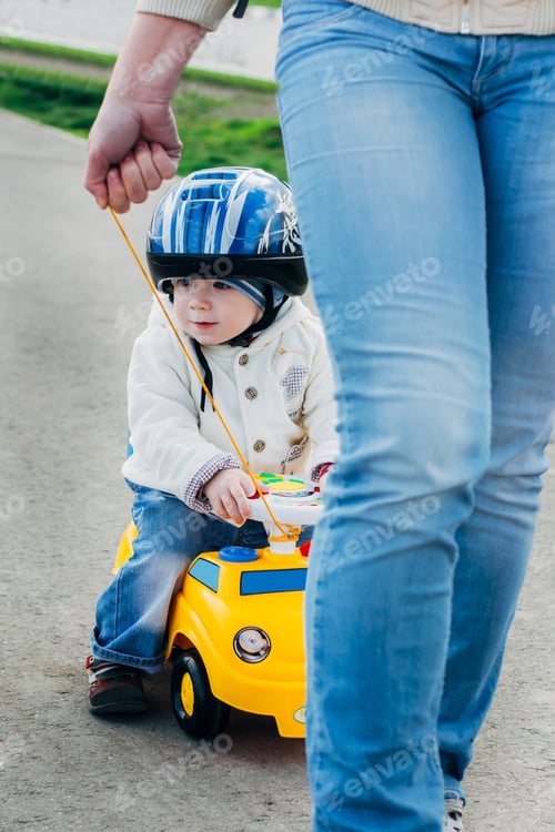 Preview: Mum With The Child Walk Along The Park
