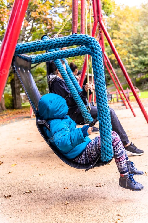 Preview: Little Autistic Girl Is Rocking On A Swing In The Park