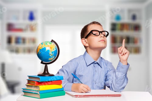Preview: Cute Schoolboy Is Writting Isolated On A White Background