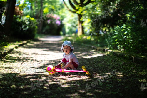 Preview: Baby Girl Play Balance Scooter At Summer Park