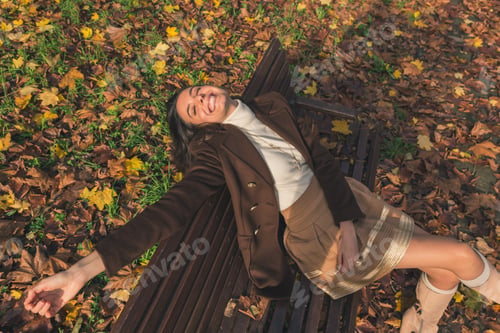 Preview: Beautiful Young Woman With Long Hair Posing In A City Park