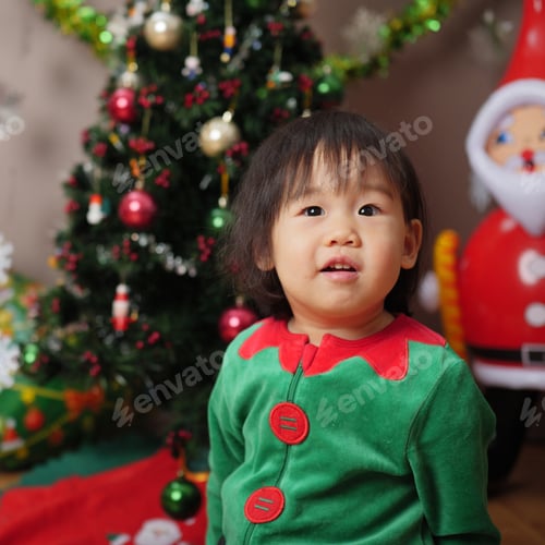 Preview: Baby Girl Decorating Christmas Tree