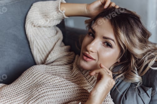 Preview: Relaxed Woman Poses on a Comfortable Sofa