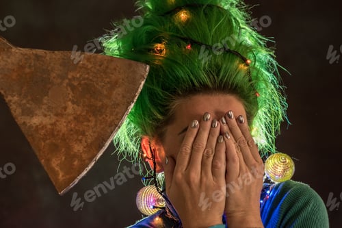 Preview: Splendid Girl With Green Hair Dressed In Christmas Garlands. A Girl Is Depicting A Christmas Tree