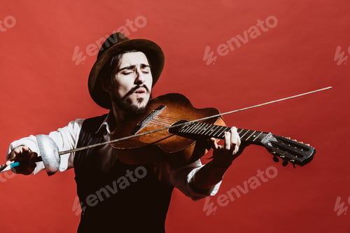 Preview: Positive Guy Playing The Guitar And Posing