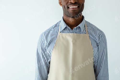 Preview: How Can I Help You. Joyful Handsome Afro Americn Waiter Waiting For Guests While Smiling