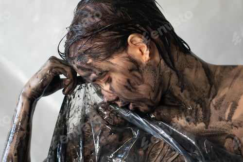 Preview: The Face Of A Young Beautiful Girl Is Painted Black