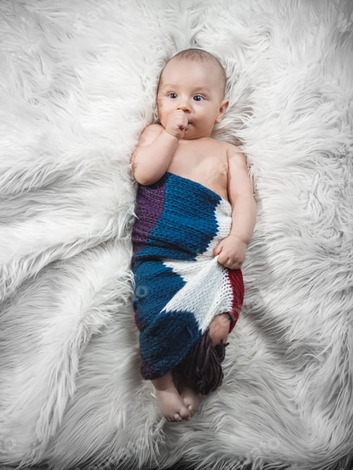 Preview: Baby Boy On Bed, Studio Shot. Above View