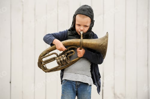 Preview: Slavic Child From An Orphanage In Old Clothes, Gathered By Parishioners Of Church, Is Playing On